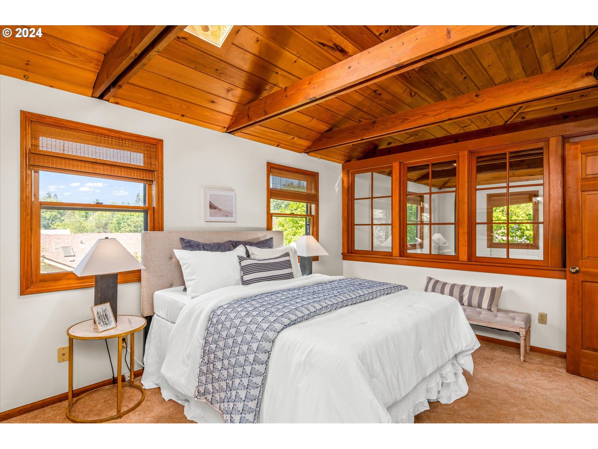 2602 Agate Street Eugene, OR 97403 - Photo 20 of 37 a bedroom with a bed a lamp and a window