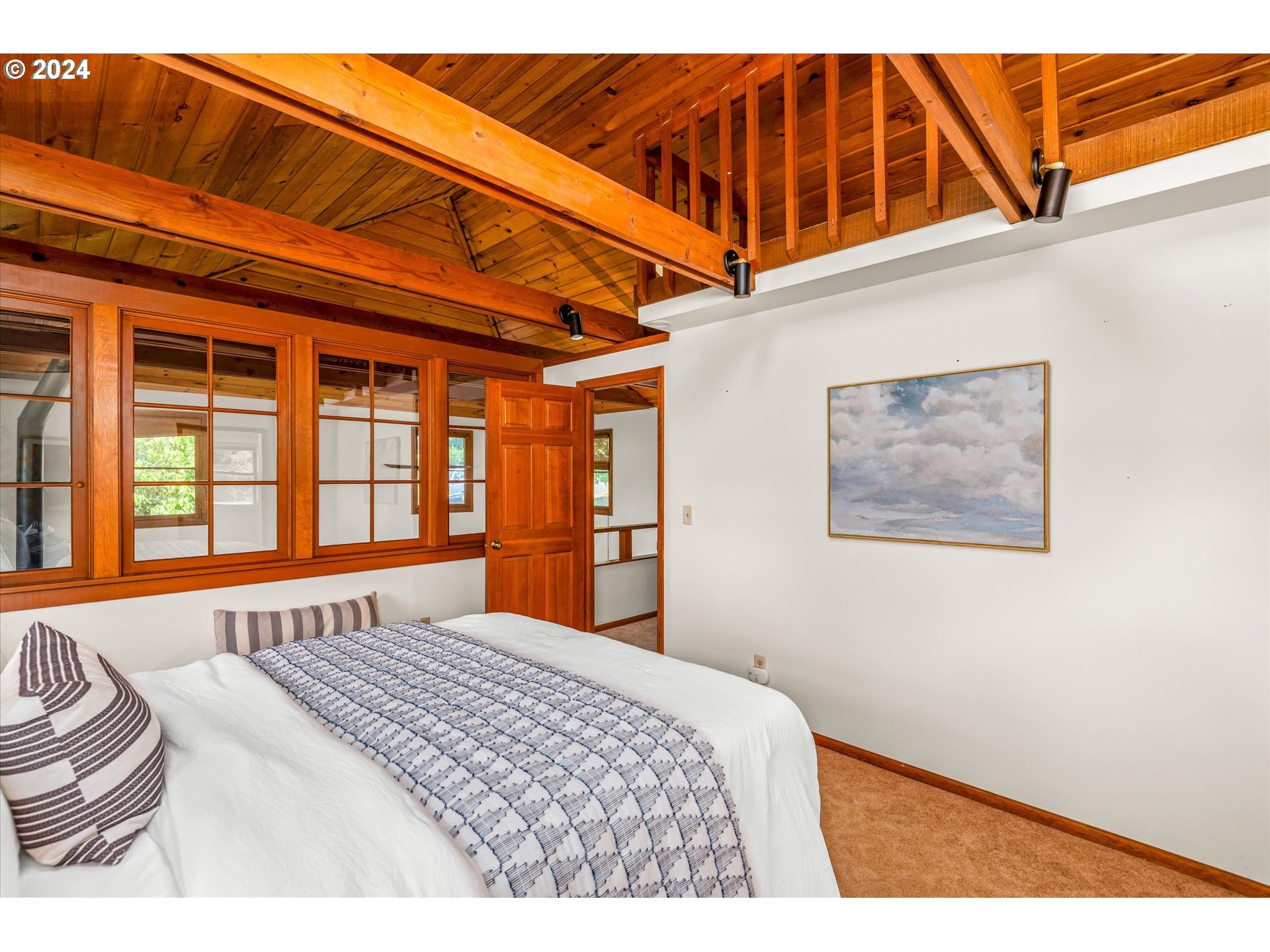 2602 Agate Street Eugene, OR 97403 - Photo 21 of 37 a bedroom with a bed and wooden floor
