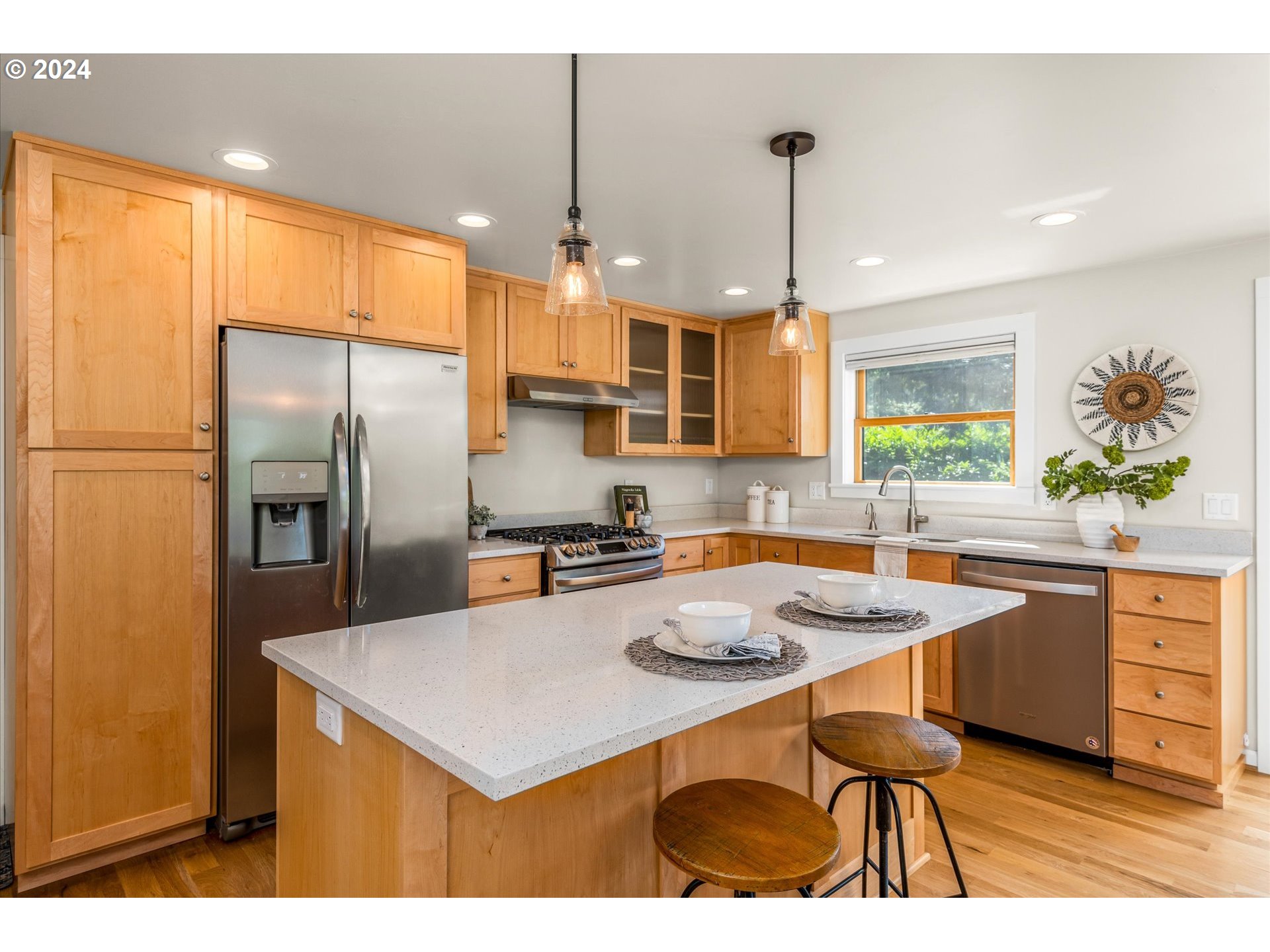 2602 Agate Street Eugene, OR 97403 - Photo 9 of 37 a kitchen with refrigerator cabinets dining table and chairs