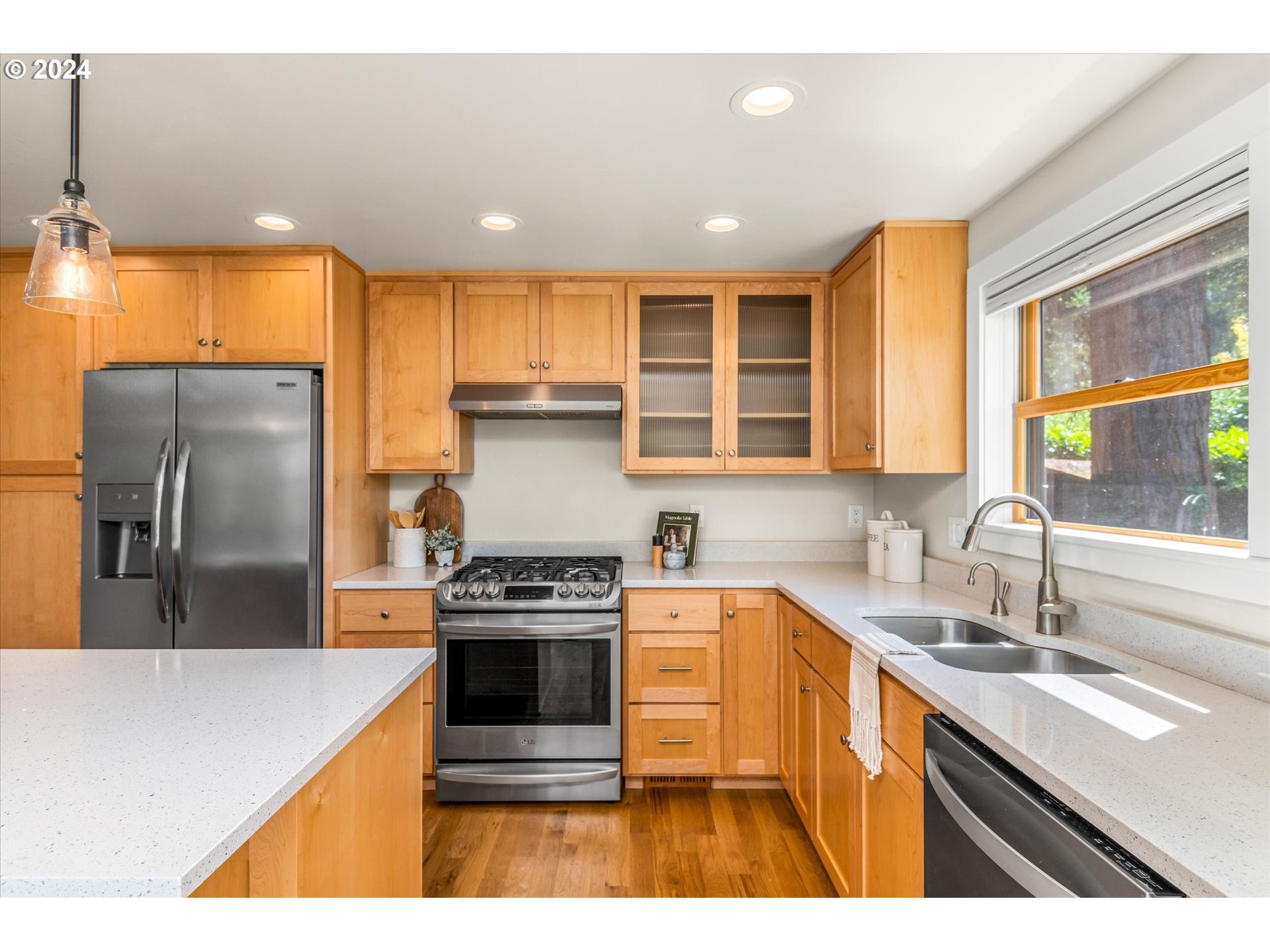 2602 Agate Street Eugene, OR 97403 - Photo 10 of 37 a kitchen with kitchen island a sink stove and refrigerator