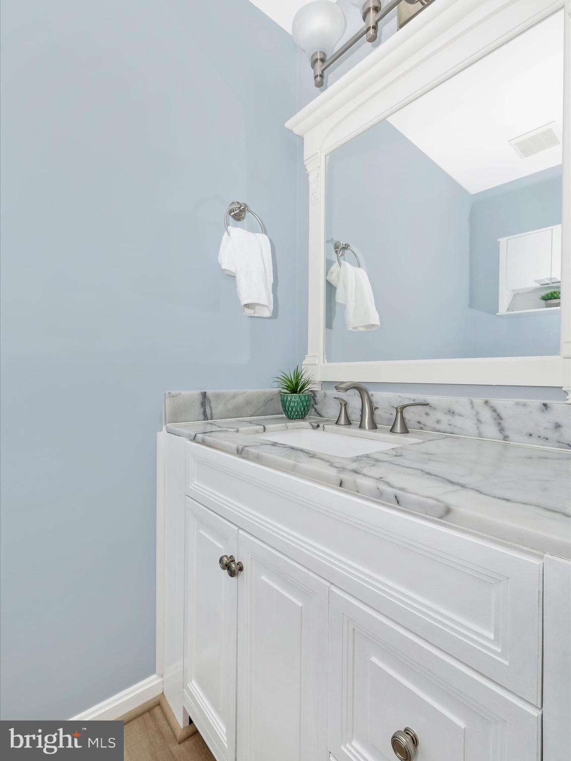 21405 Emerald Drive Germantown, MD 20876 - Photo 11 of 51 a bathroom with a sink and mirror