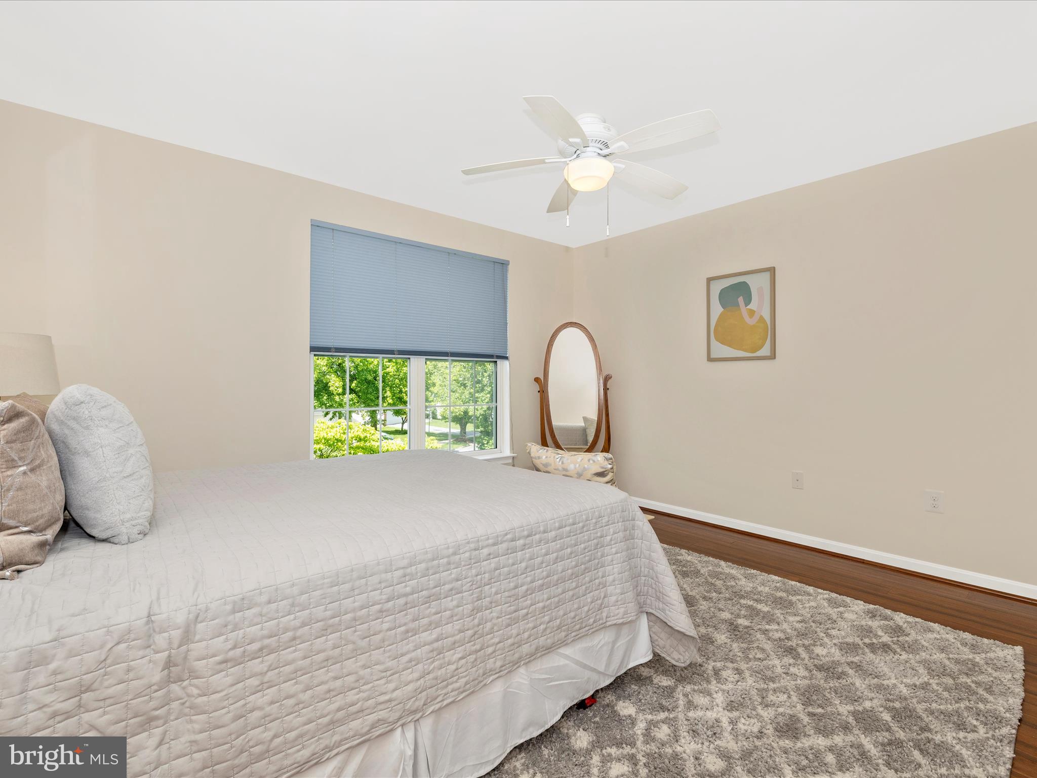 21405 Emerald Drive Germantown, MD 20876 - Photo 19 of 51 a bedroom with a bed and a window