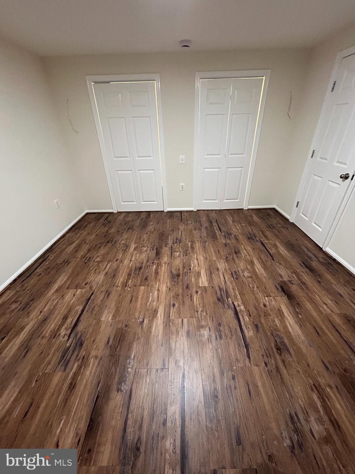 21405 Emerald Drive Germantown, MD 20876 - Photo 27 of 51 a view of room with wooden floor