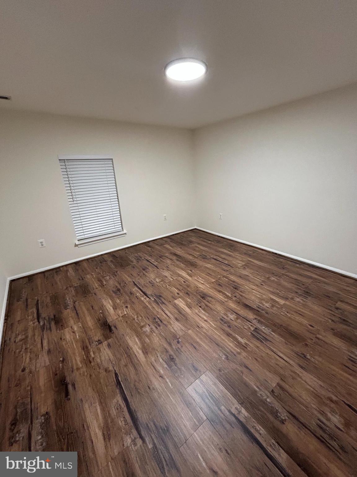 21405 Emerald Drive Germantown, MD 20876 - Photo 28 of 51 a view of room with wooden floor