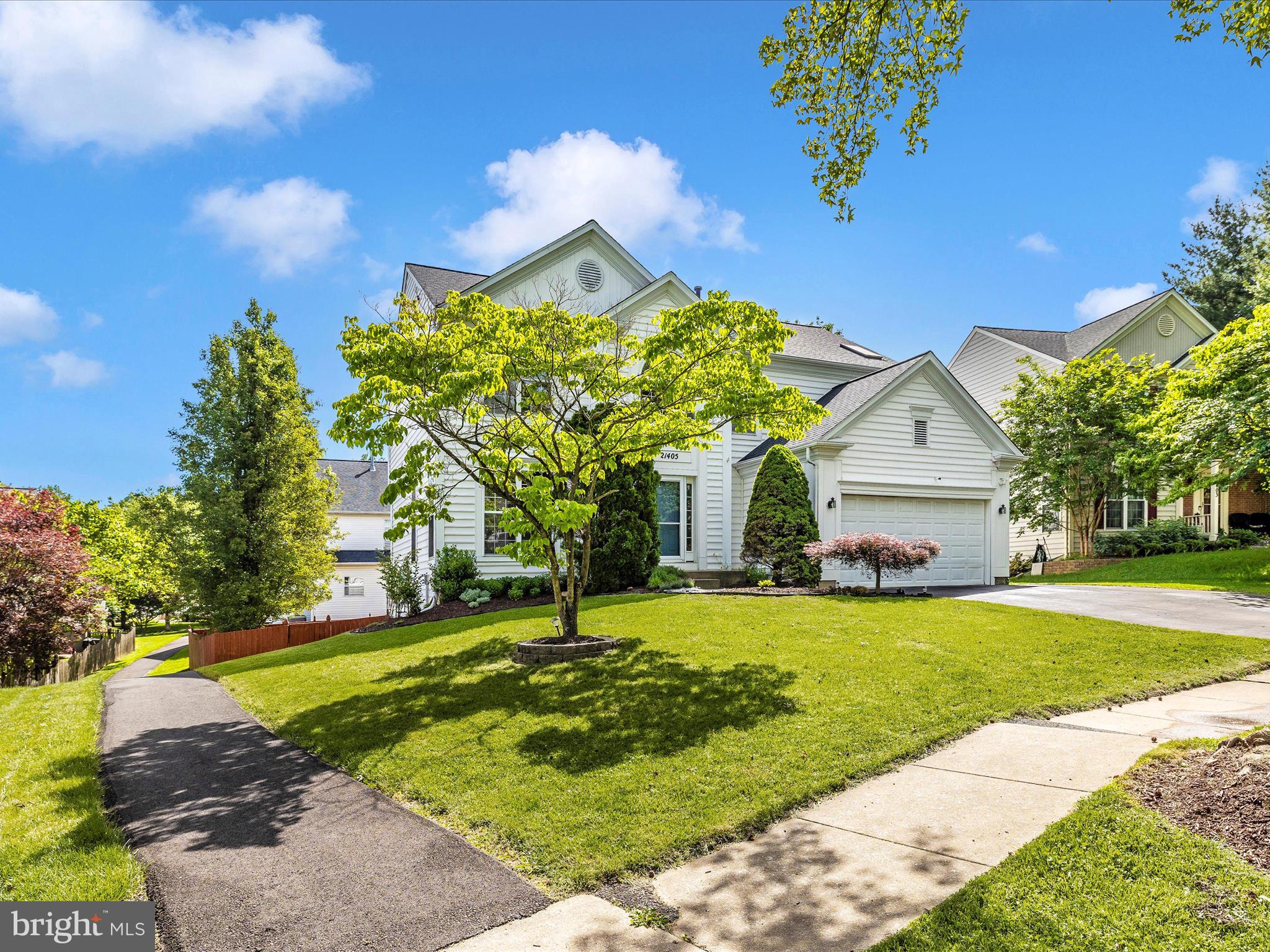 21405 Emerald Drive Germantown, MD 20876 - Photo 35 of 51 a front view of a house with garden