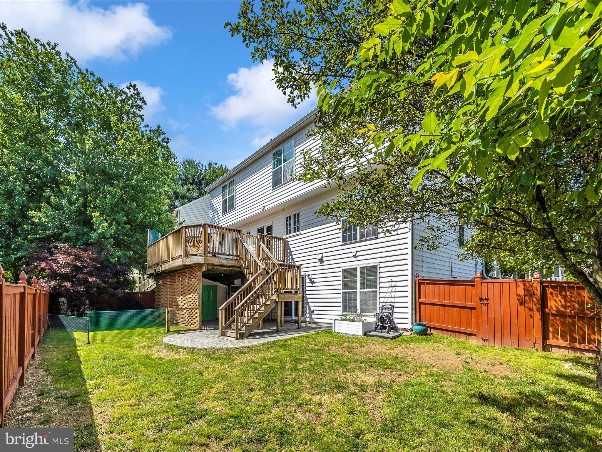 21405 Emerald Drive Germantown, MD 20876 - Photo 36 of 51 a view of a house with a yard