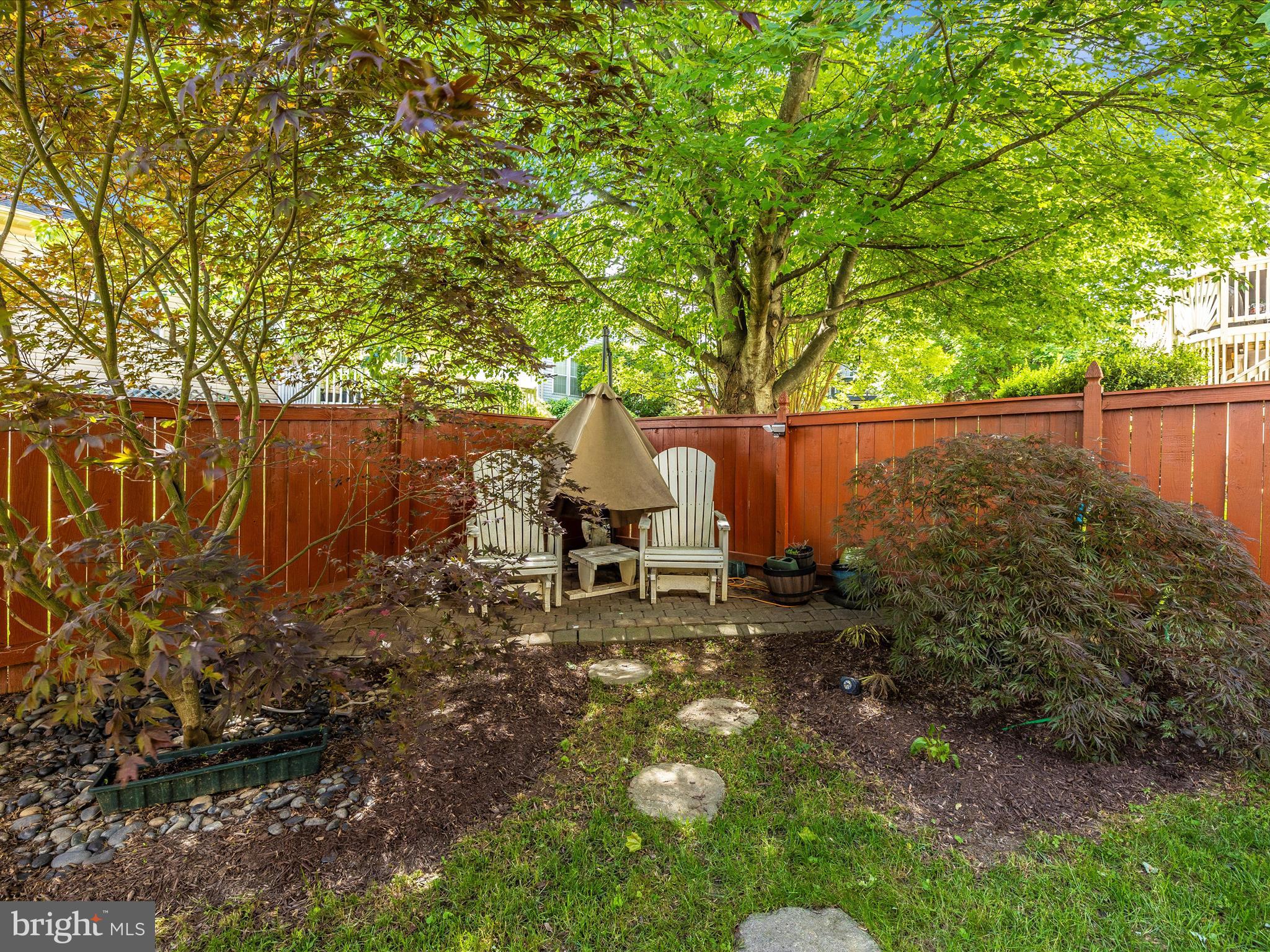 21405 Emerald Drive Germantown, MD 20876 - Photo 38 of 51 a backyard of a house with table and chairs