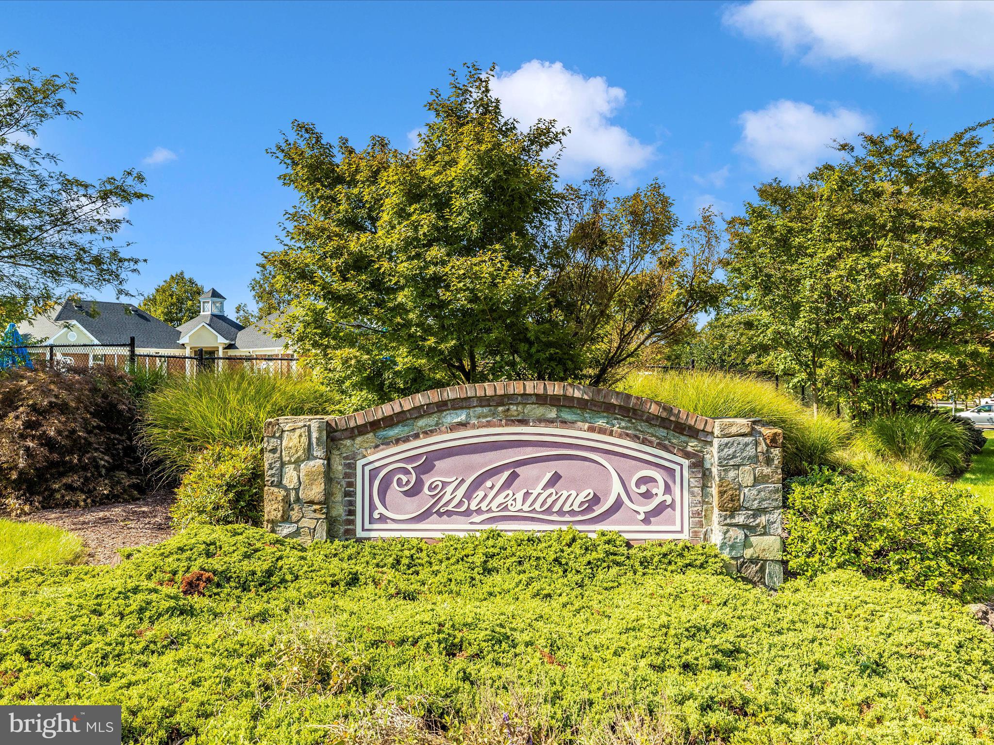 21405 Emerald Drive Germantown, MD 20876 - Photo 44 of 51 a sign of golf club on a wall under a tree