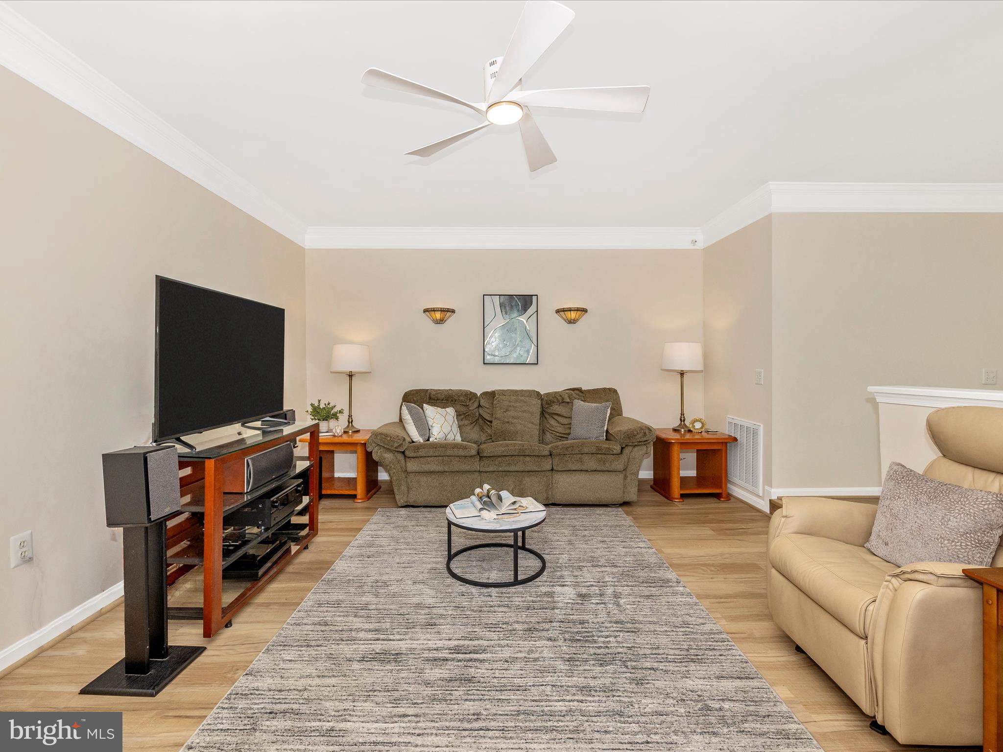 21405 Emerald Drive Germantown, MD 20876 - Photo 10 of 51 a living room with furniture and a flat screen tv