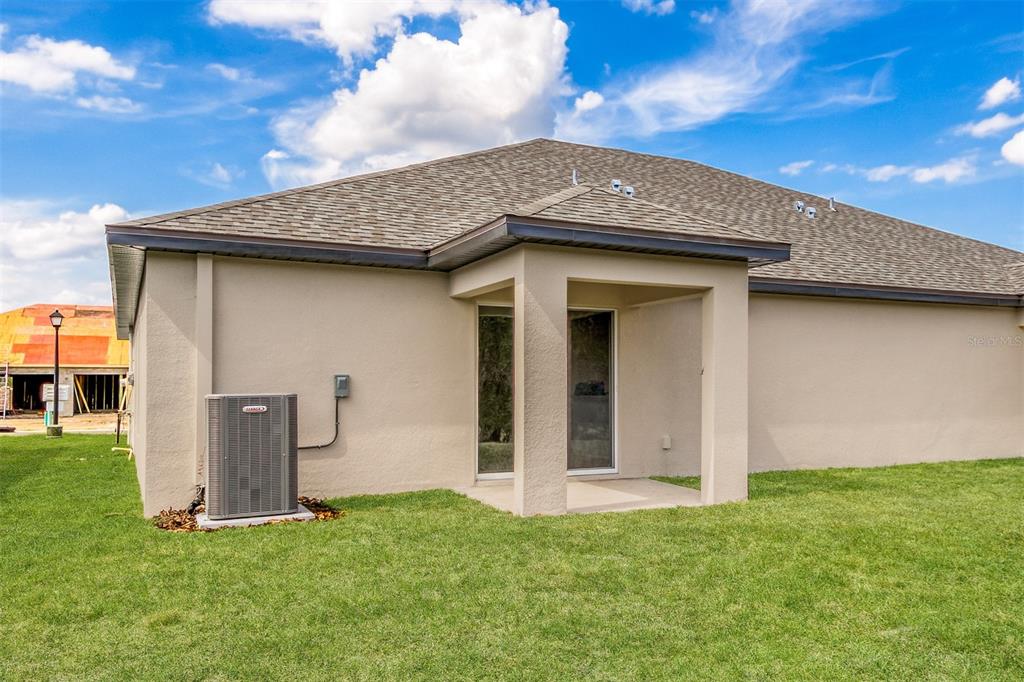 3207 Seville Street Lake Alfred, FL 33850 - Photo 13 of 14 a front view of a house with a garden