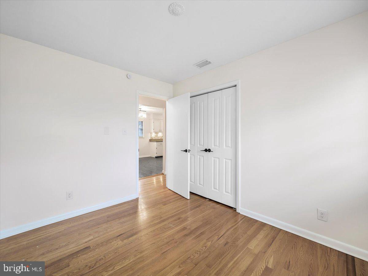 570 Welltown Road Winchester, VA 22603 - Photo 15 of 29 a view of an empty room with wooden floor