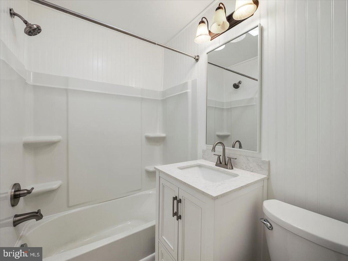 570 Welltown Road Winchester, VA 22603 - Photo 16 of 29 a bathroom with a sink a toilet and shower
