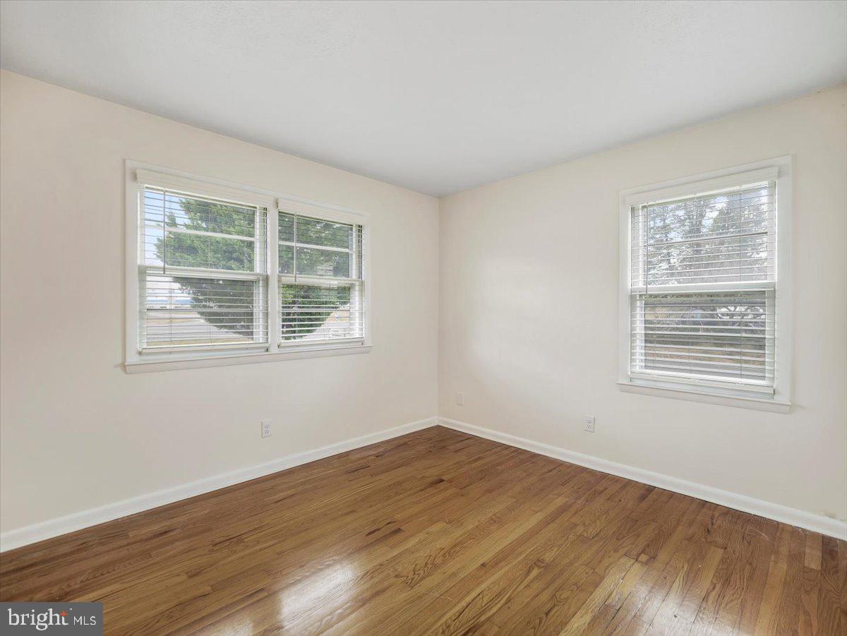 570 Welltown Road Winchester, VA 22603 - Photo 17 of 29 a view of an empty room with wooden floor and a window