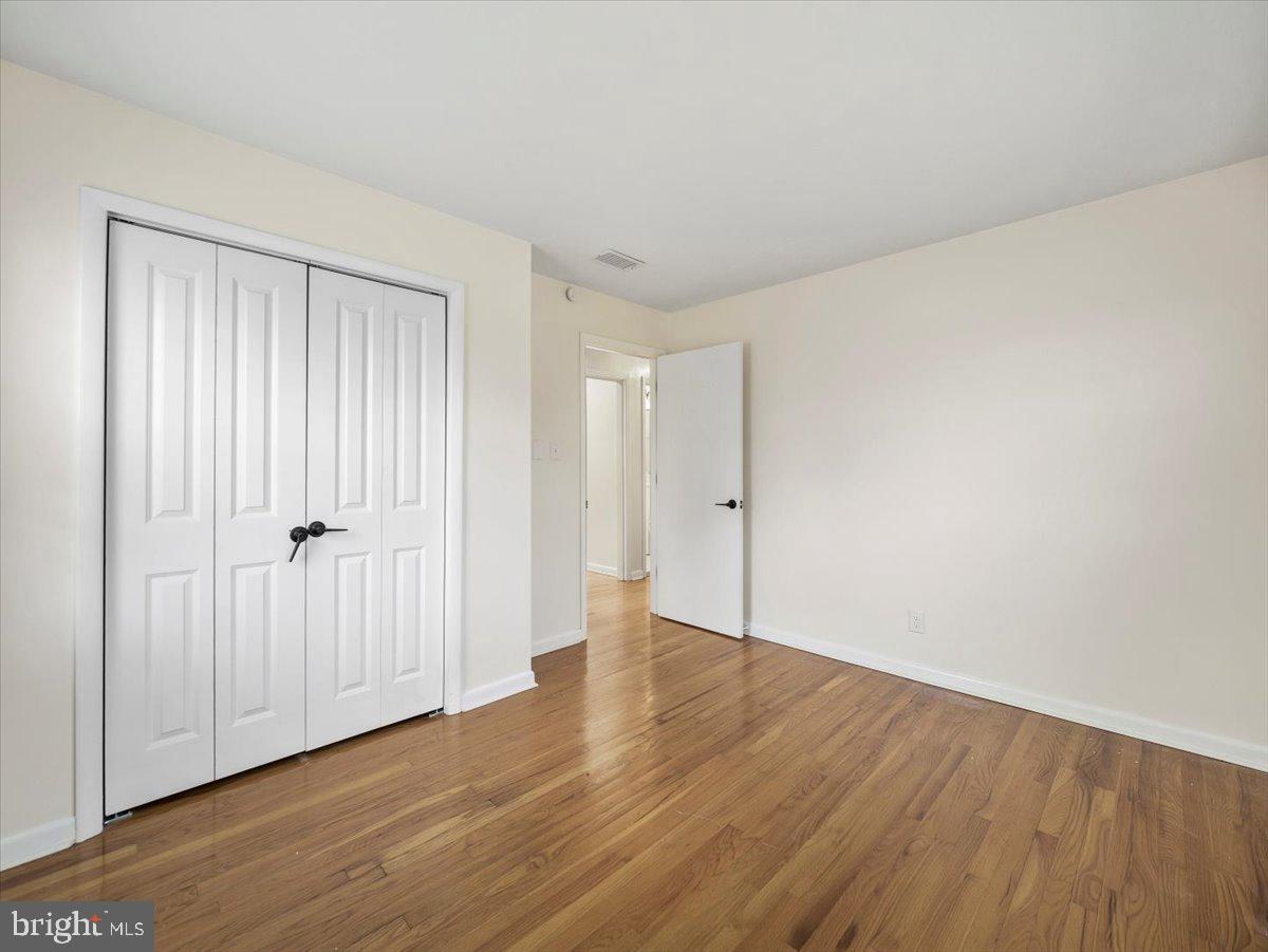 570 Welltown Road Winchester, VA 22603 - Photo 18 of 29 a view of an empty room with wooden floor