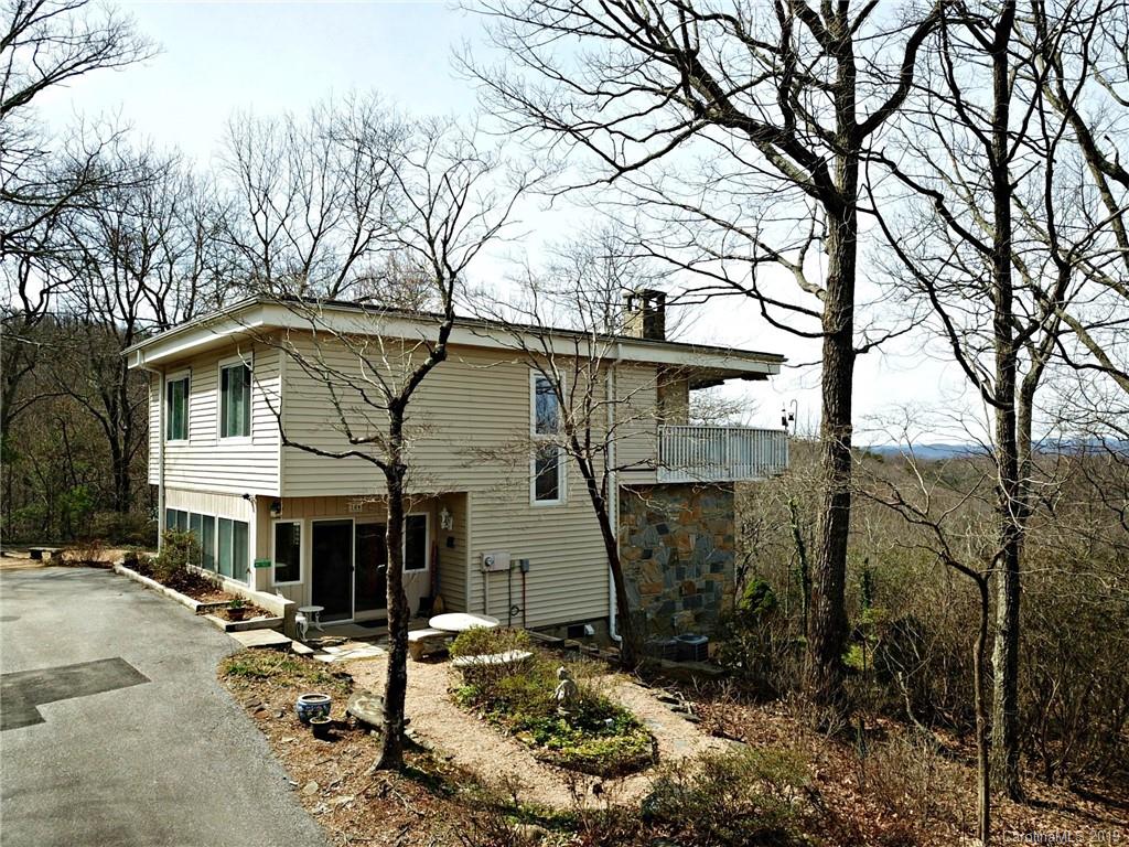 104 Little Falls Drive Tryon, NC 28782 - Photo 1 of 21 a front view of a house with a yard