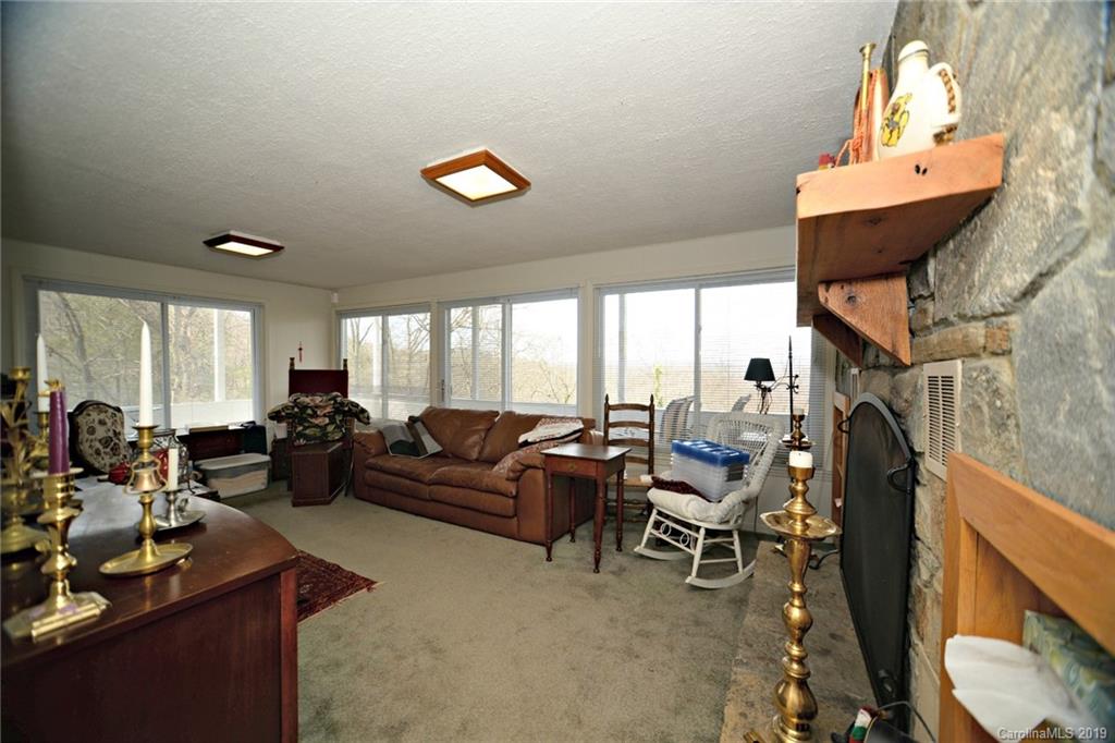 104 Little Falls Drive Tryon, NC 28782 - Photo 11 of 21 a living room with furniture and a large window