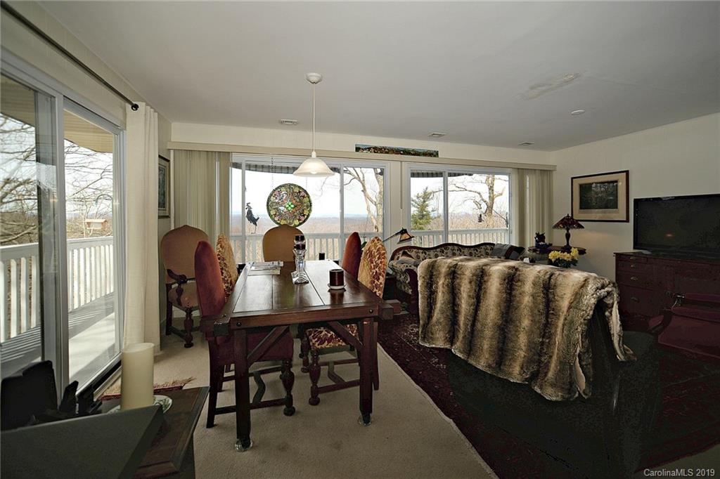104 Little Falls Drive Tryon, NC 28782 - Photo 12 of 21 a living room with furniture fireplace and flat screen tv