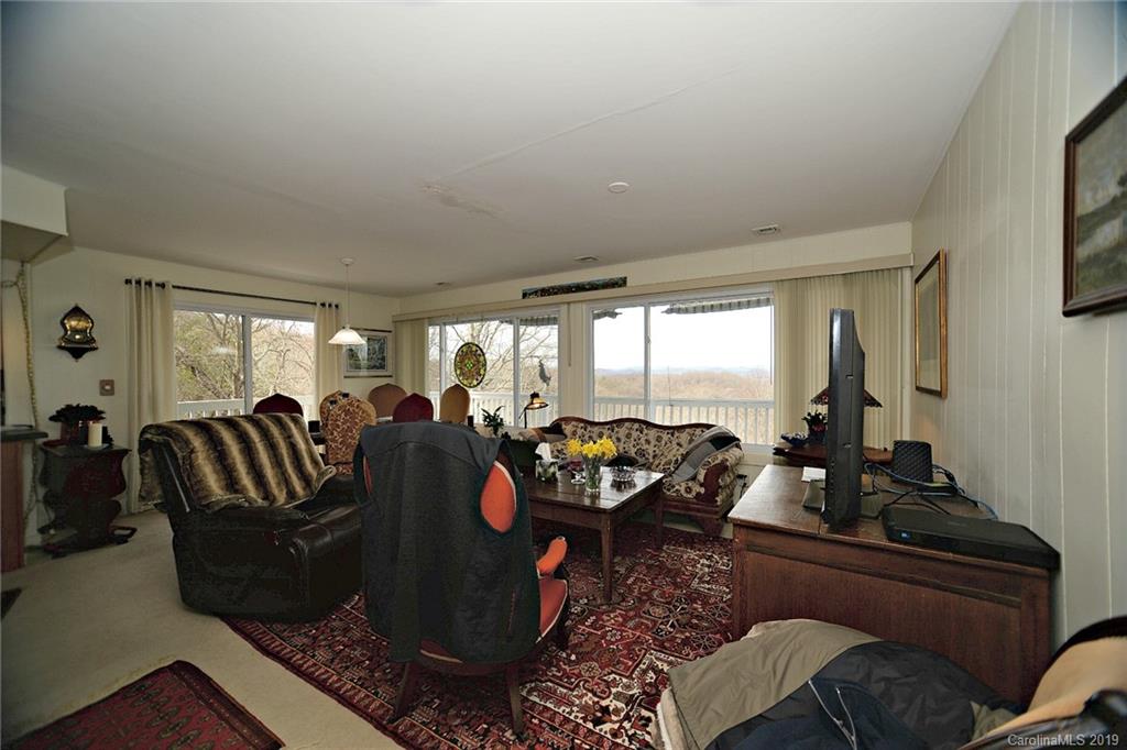 104 Little Falls Drive Tryon, NC 28782 - Photo 13 of 21 a living room with furniture and a large window