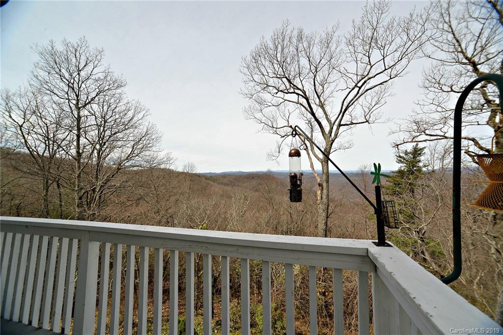 104 Little Falls Drive Tryon, NC 28782 - Photo 15 of 21 a view of a balcony with wooden fence and floor