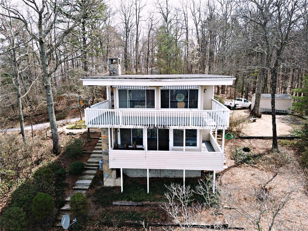 104 Little Falls Drive Tryon, NC 28782 - Photo 3 of 21 a view of a house with a yard