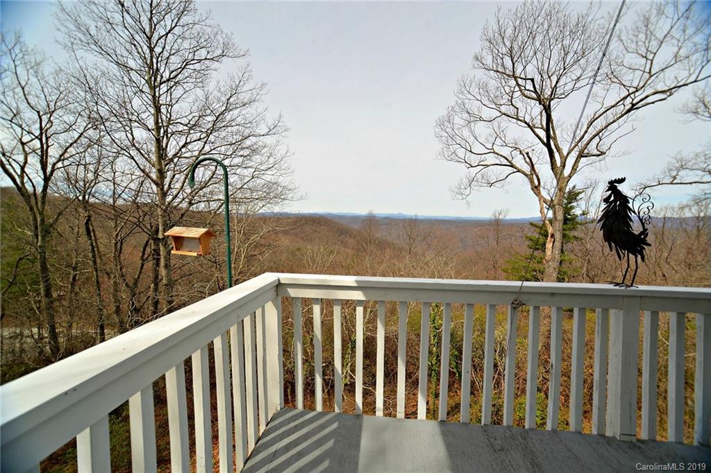 104 Little Falls Drive Tryon, NC 28782 - Photo 8 of 21 a view of a wooden deck and trees