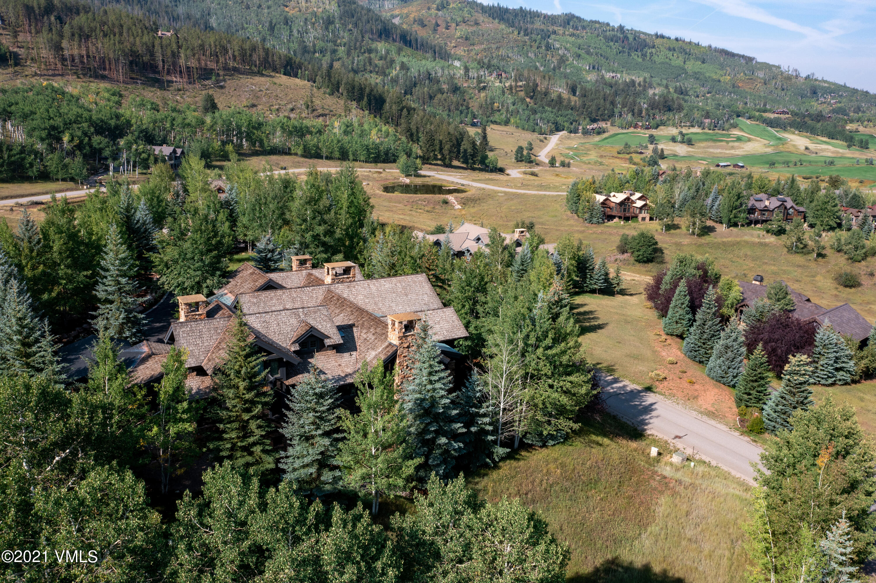 78 Aspen Meadows Road Edwards, CO 81632 - Photo 15 of 16 a view of lake and residential houses with outdoor space and trees