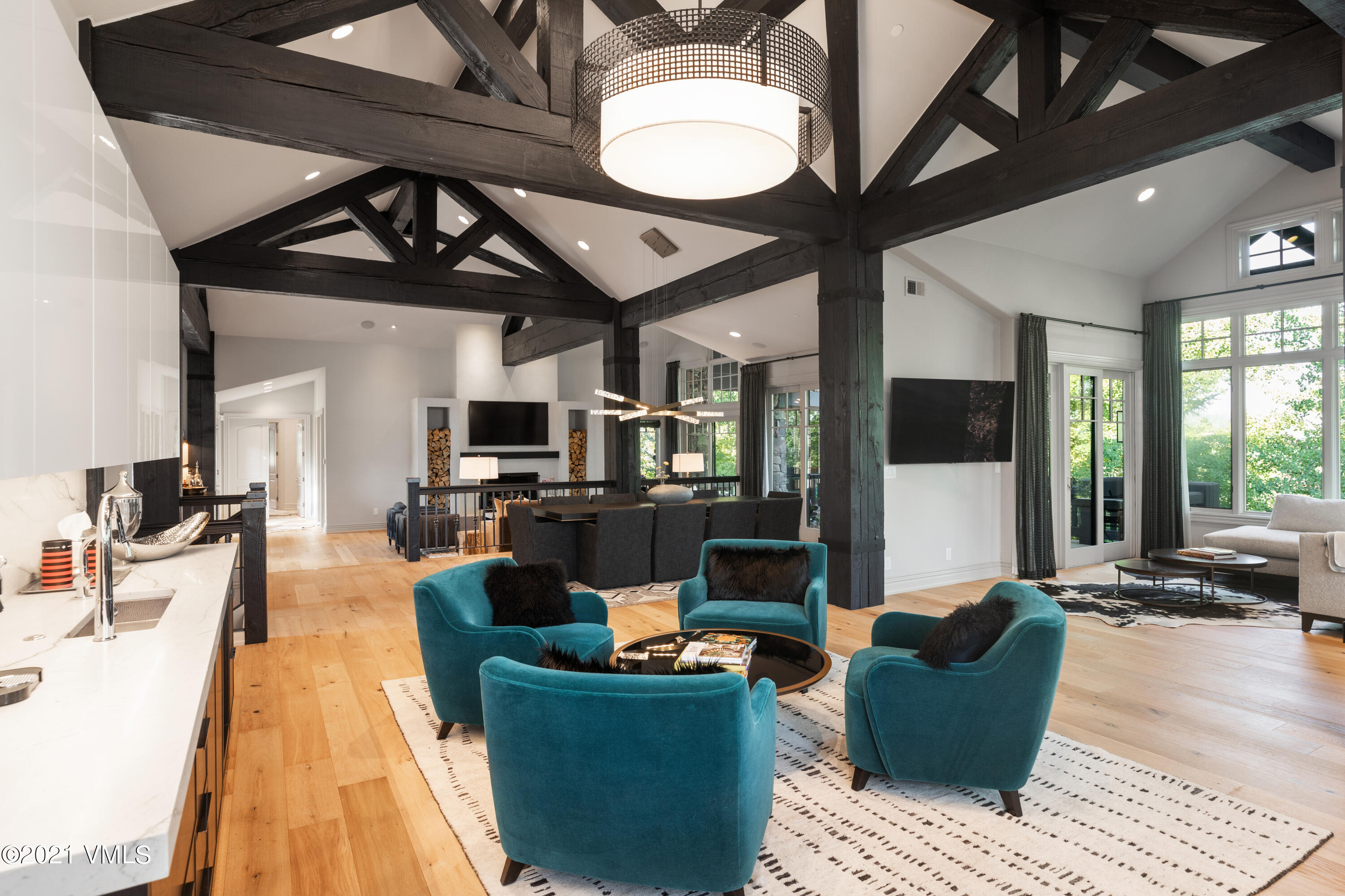 78 Aspen Meadows Road Edwards, CO 81632 - Photo 3 of 16 a living room with fireplace furniture and a flat screen tv