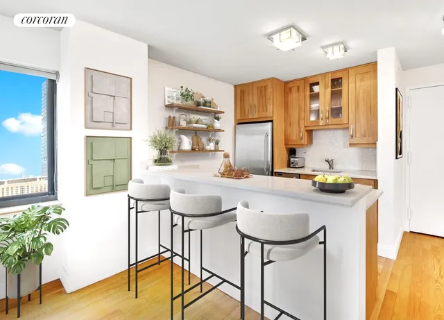 a kitchen with a table chairs stove and kitchen view