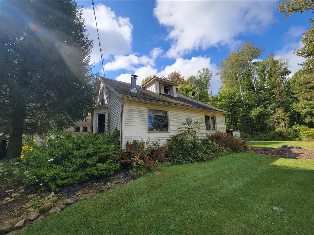 227 Crystal Spring Road Sandy Lake, PA 16145 - Photo 16 of 50 a view of a house with garden