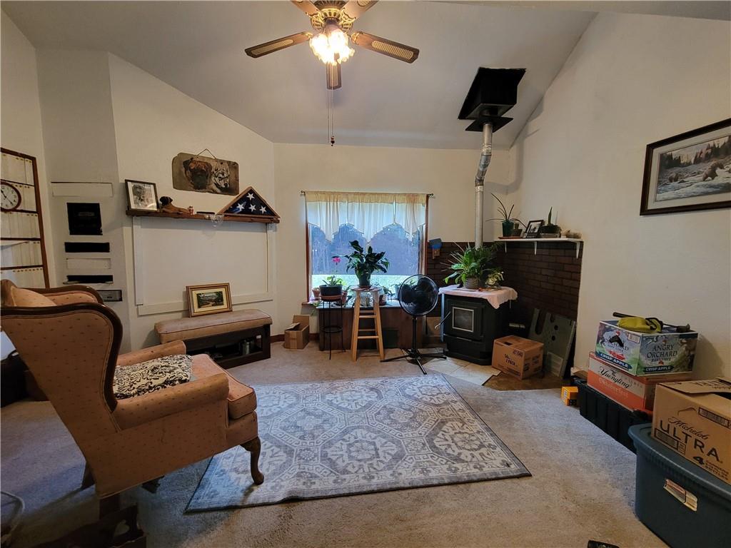 227 Crystal Spring Road Sandy Lake, PA 16145 - Photo 23 of 50 a living room with furniture and a chandelier