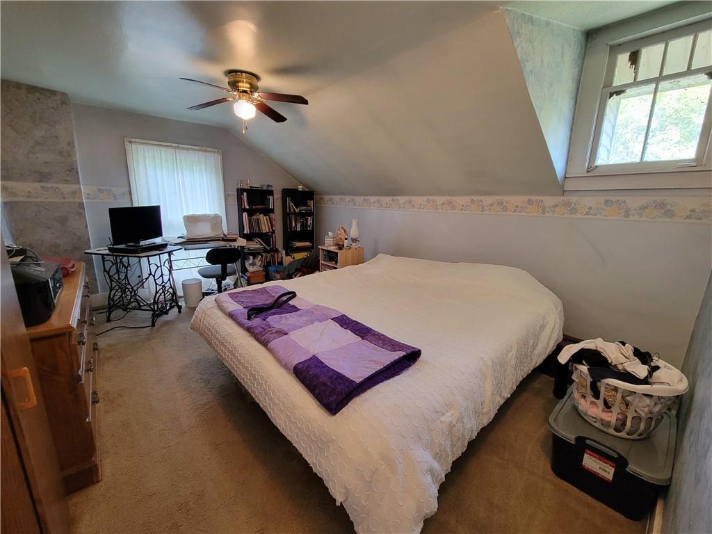 227 Crystal Spring Road Sandy Lake, PA 16145 - Photo 38 of 50 a bed room with a bed furniture and a flat tv screen