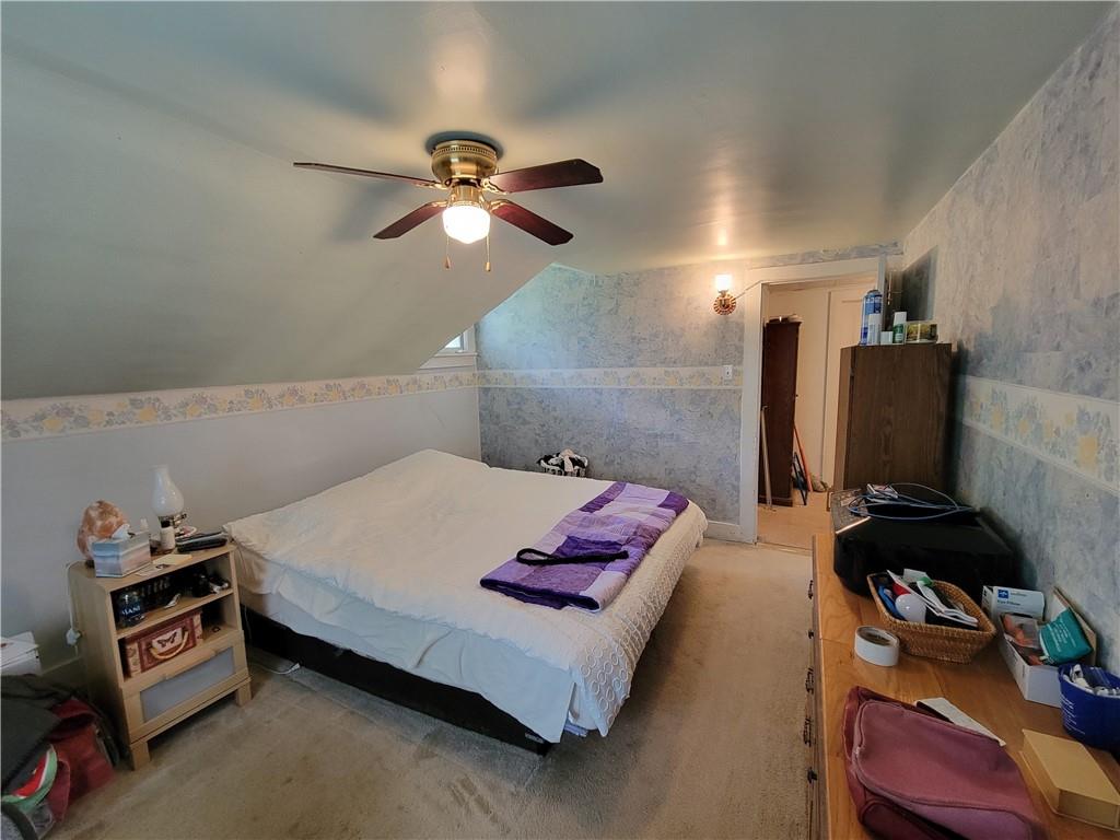 227 Crystal Spring Road Sandy Lake, PA 16145 - Photo 39 of 50 a bedroom with a bed and a flat screen tv