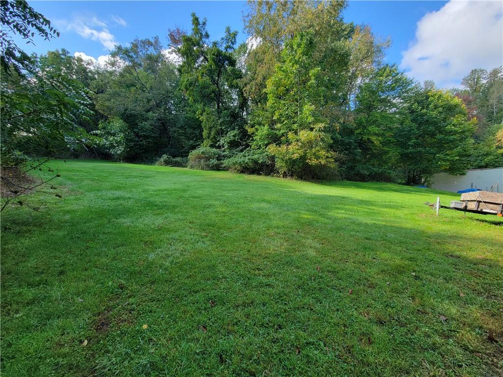 227 Crystal Spring Road Sandy Lake, PA 16145 - Photo 4 of 50 a view of a field of grass and trees