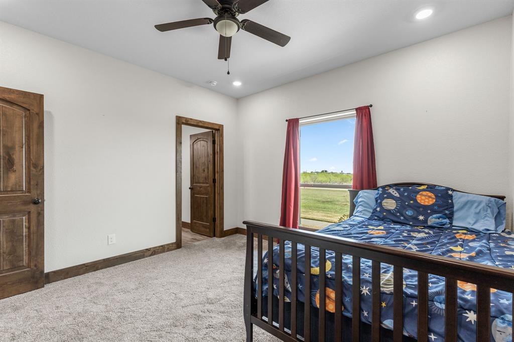 515 Sales Road Windthorst, TX 76389 - Photo 26 of 34 a view of a hallway with a workspace