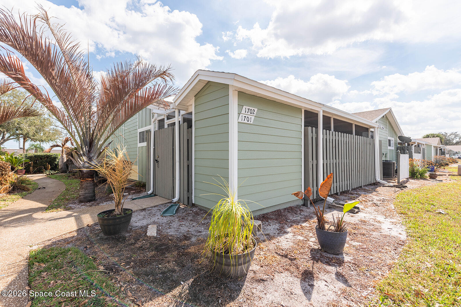 1954 Quail Ridge Court, Unit 1701 Cocoa, FL 32926 - Photo 1 of 41 a view of a back yard of the house