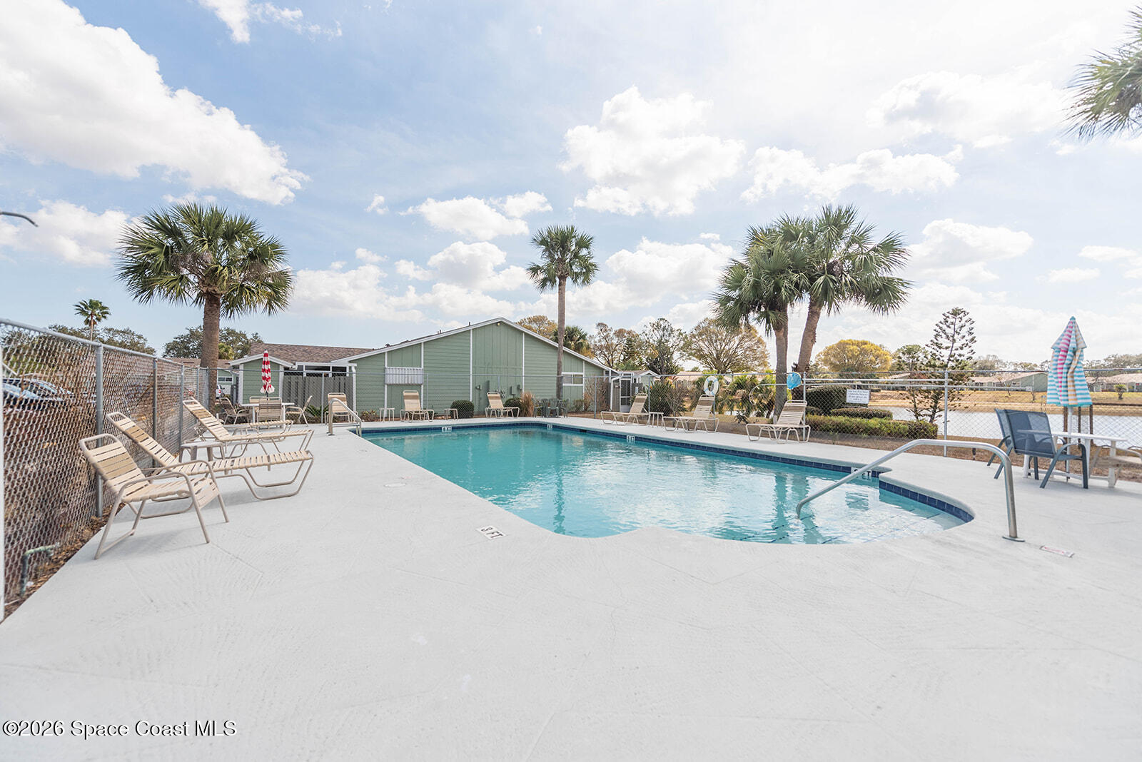1954 Quail Ridge Court, Unit 1701 Cocoa, FL 32926 - Photo 12 of 41 a view of swimming pool with outdoor seating and city view
