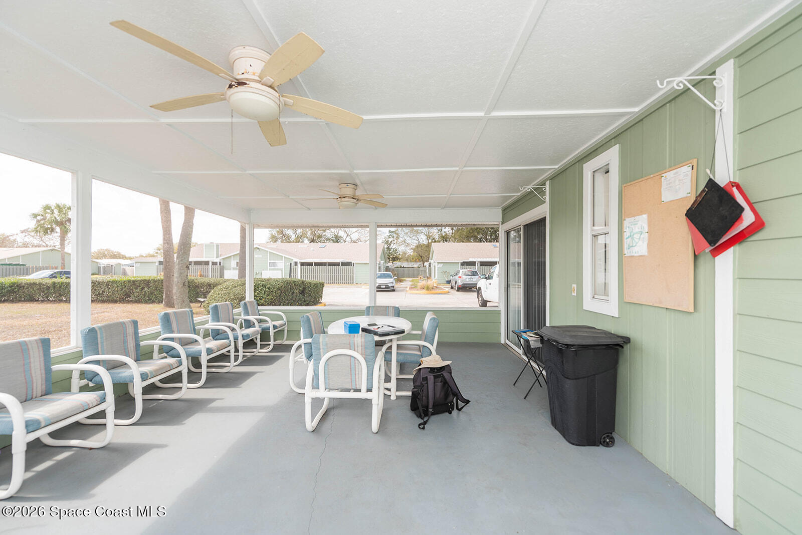 1954 Quail Ridge Court, Unit 1701 Cocoa, FL 32926 - Photo 14 of 41 a room with gym equipment and a large window
