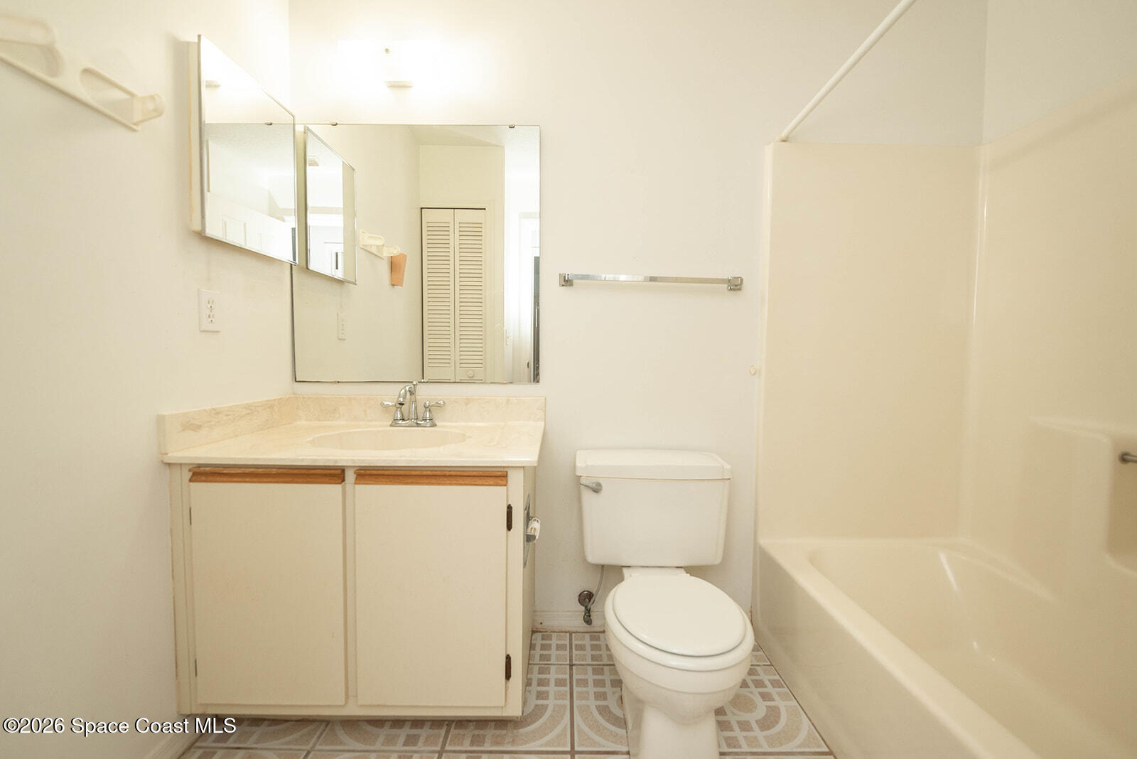 1954 Quail Ridge Court, Unit 1701 Cocoa, FL 32926 - Photo 20 of 41 a bathroom with a sink toilet and shower