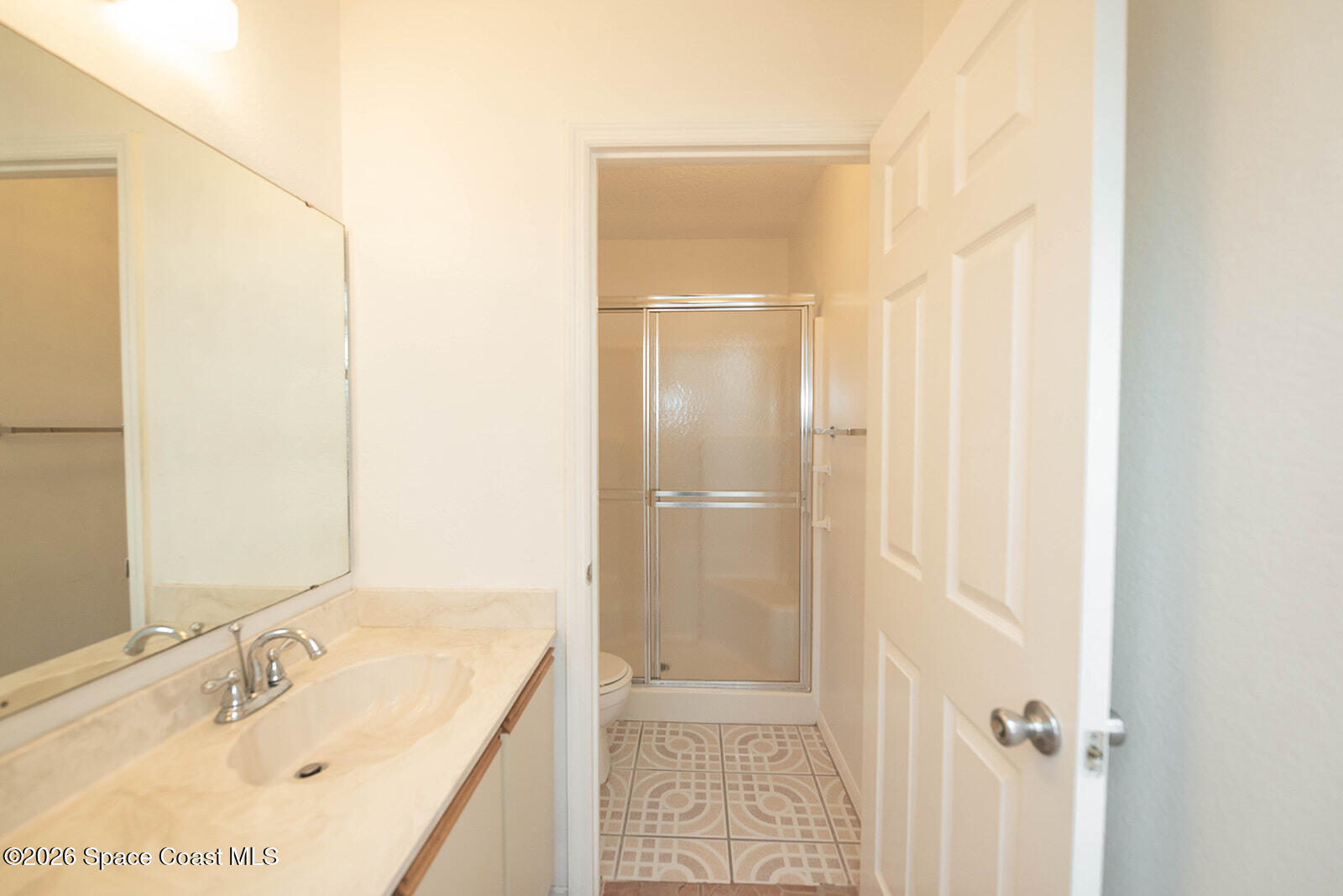 1954 Quail Ridge Court, Unit 1701 Cocoa, FL 32926 - Photo 28 of 41 a bathroom with a tub and shower