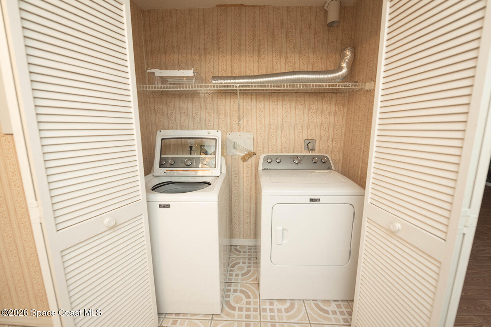 1954 Quail Ridge Court, Unit 1701 Cocoa, FL 32926 - Photo 31 of 41 a utility room with dryer and washer
