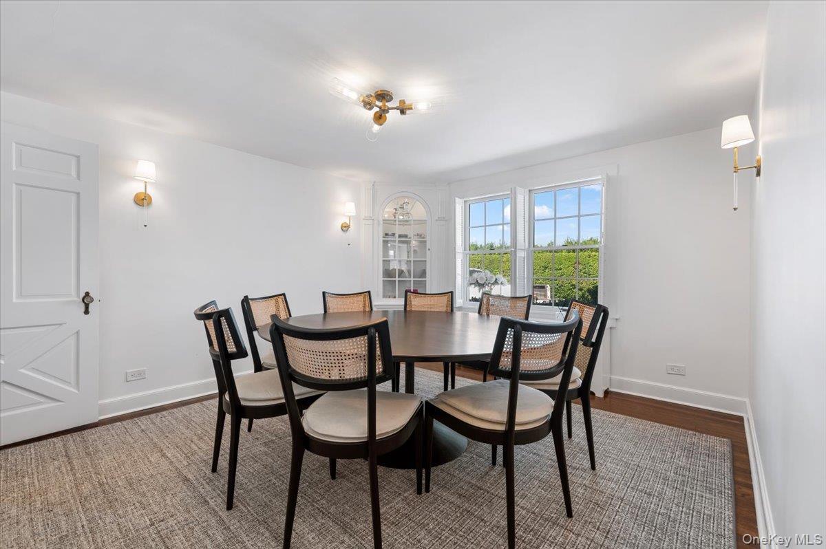 2 Strongs Lane Water Mill, NY 11976 - Photo 19 of 47 Dining area with baseboards and dark wood finished floors