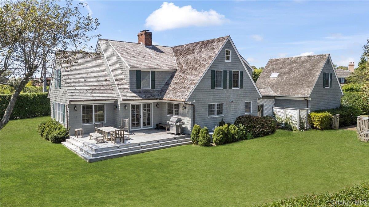 2 Strongs Lane Water Mill, NY 11976 - Photo 3 of 47 Rear view of house featuring a yard, a chimney, and a wooden deck