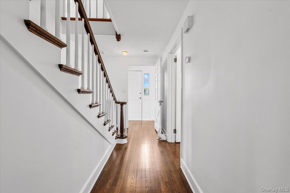 2 Strongs Lane Water Mill, NY 11976 - Photo 31 of 47 Entryway with stairway and dark wood-style flooring