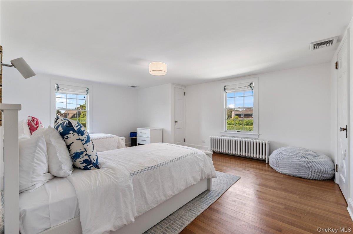 2 Strongs Lane Water Mill, NY 11976 - Photo 36 of 47 Bedroom with radiator and wood finished floors