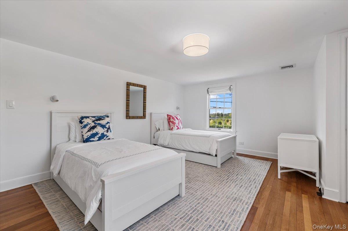 2 Strongs Lane Water Mill, NY 11976 - Photo 37 of 47 Bedroom featuring wood finished floors and baseboards