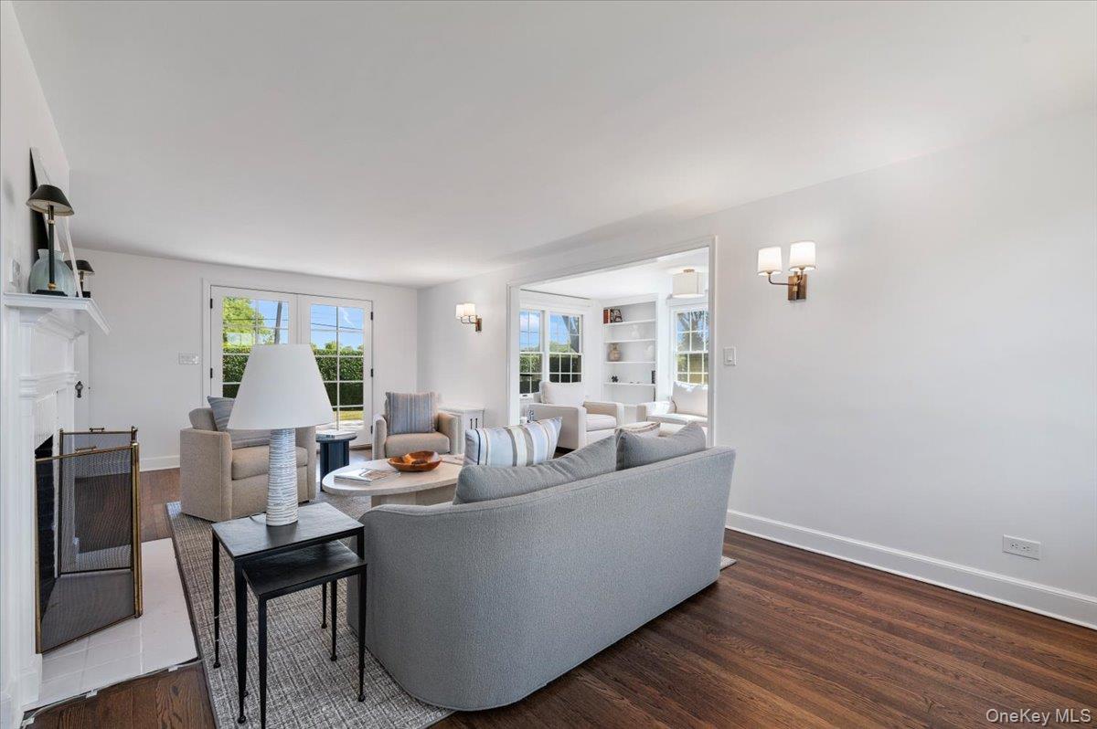 2 Strongs Lane Water Mill, NY 11976 - Photo 7 of 47 Living area with a fireplace and dark wood-style floors