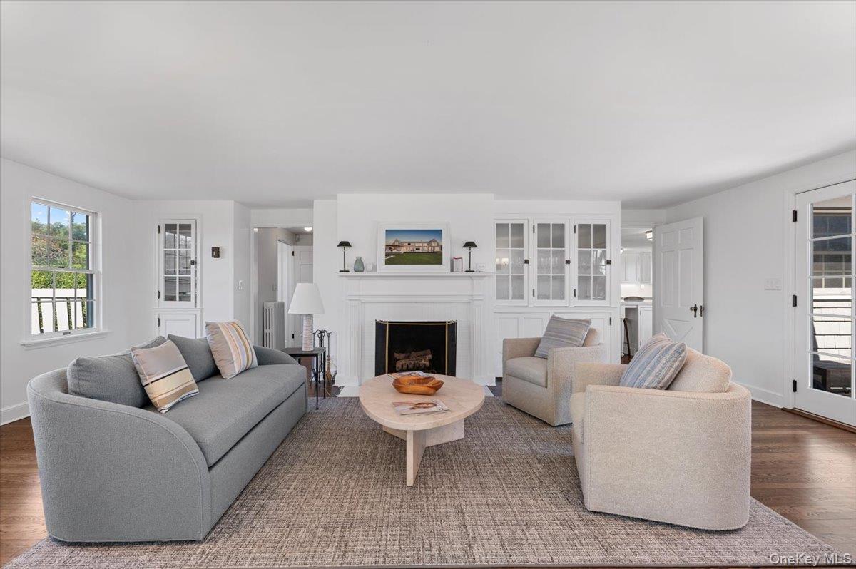 2 Strongs Lane Water Mill, NY 11976 - Photo 9 of 47 Living room with healthy amount of natural light, wood finished floors, and a fireplace
