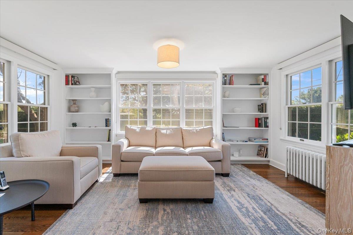 2 Strongs Lane Water Mill, NY 11976 - Photo 10 of 47 Sitting room featuring wood finished floors, radiator, and built in shelves