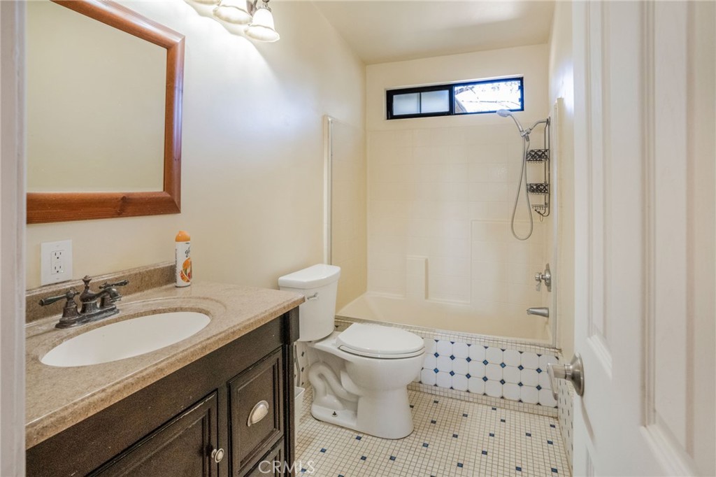 49750 3 Points Road Lancaster, CA 93536 - Photo 14 of 67 a bathroom with a sink a toilet a shower and a mirror