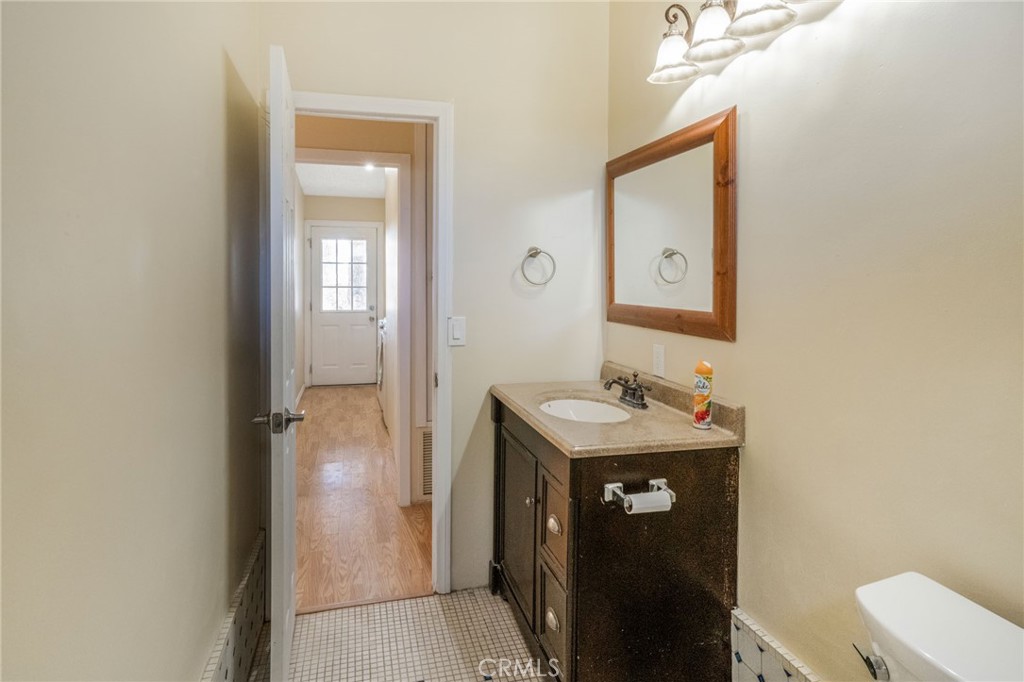 49750 3 Points Road Lancaster, CA 93536 - Photo 15 of 67 a bathroom with a sink a toilet and mirror